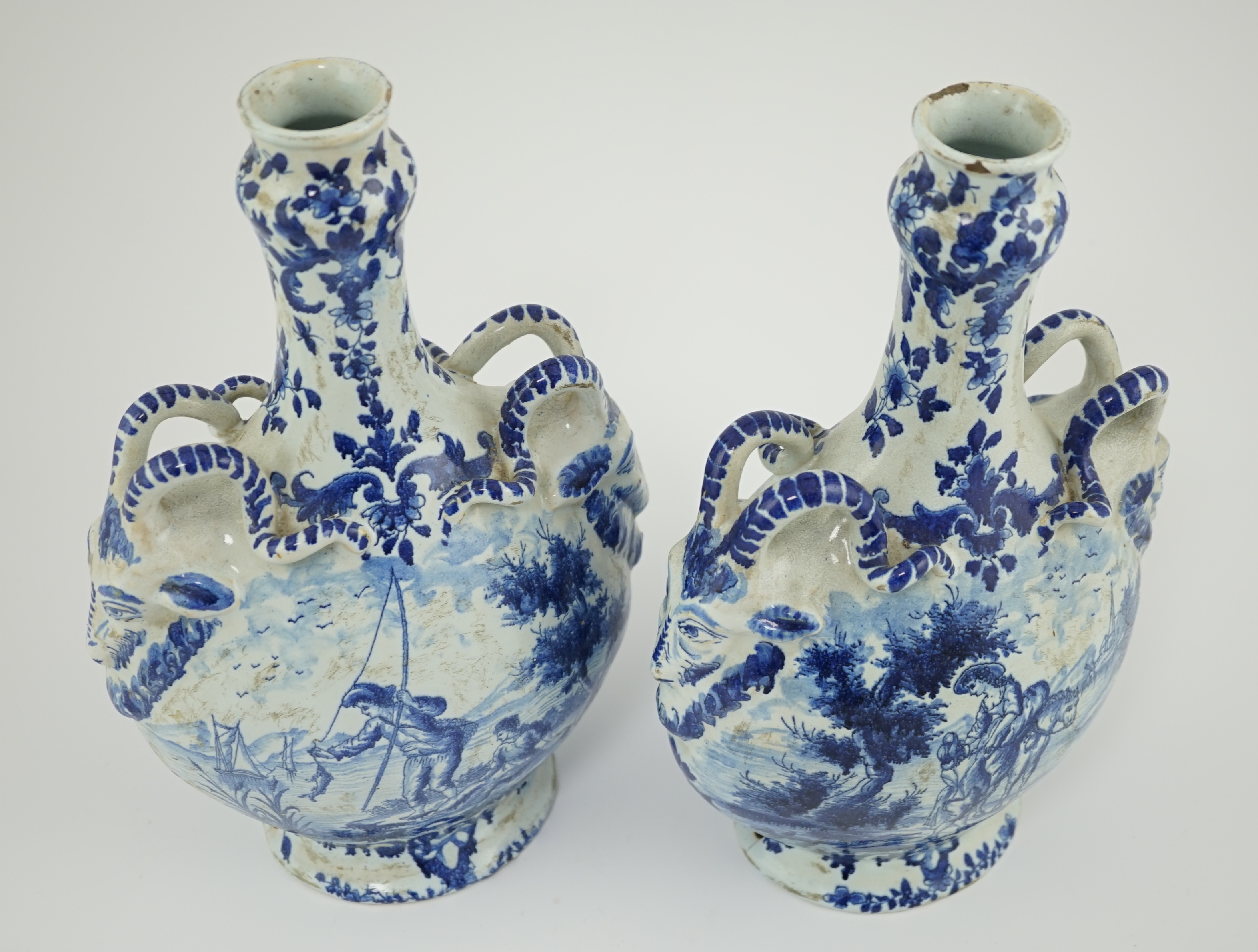 A pair of mid 18th century Delft blue and white flagons